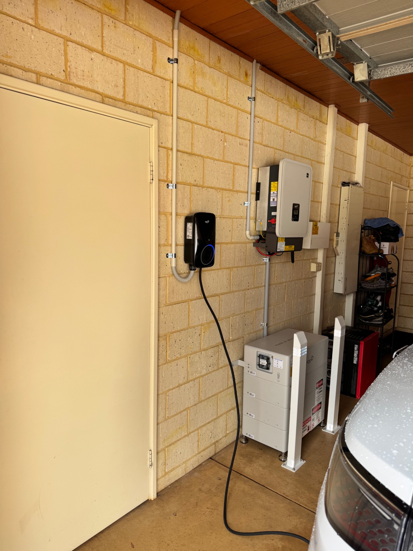 Wide view of the finished Beechboro garage with Fox ESS battery and EV charger