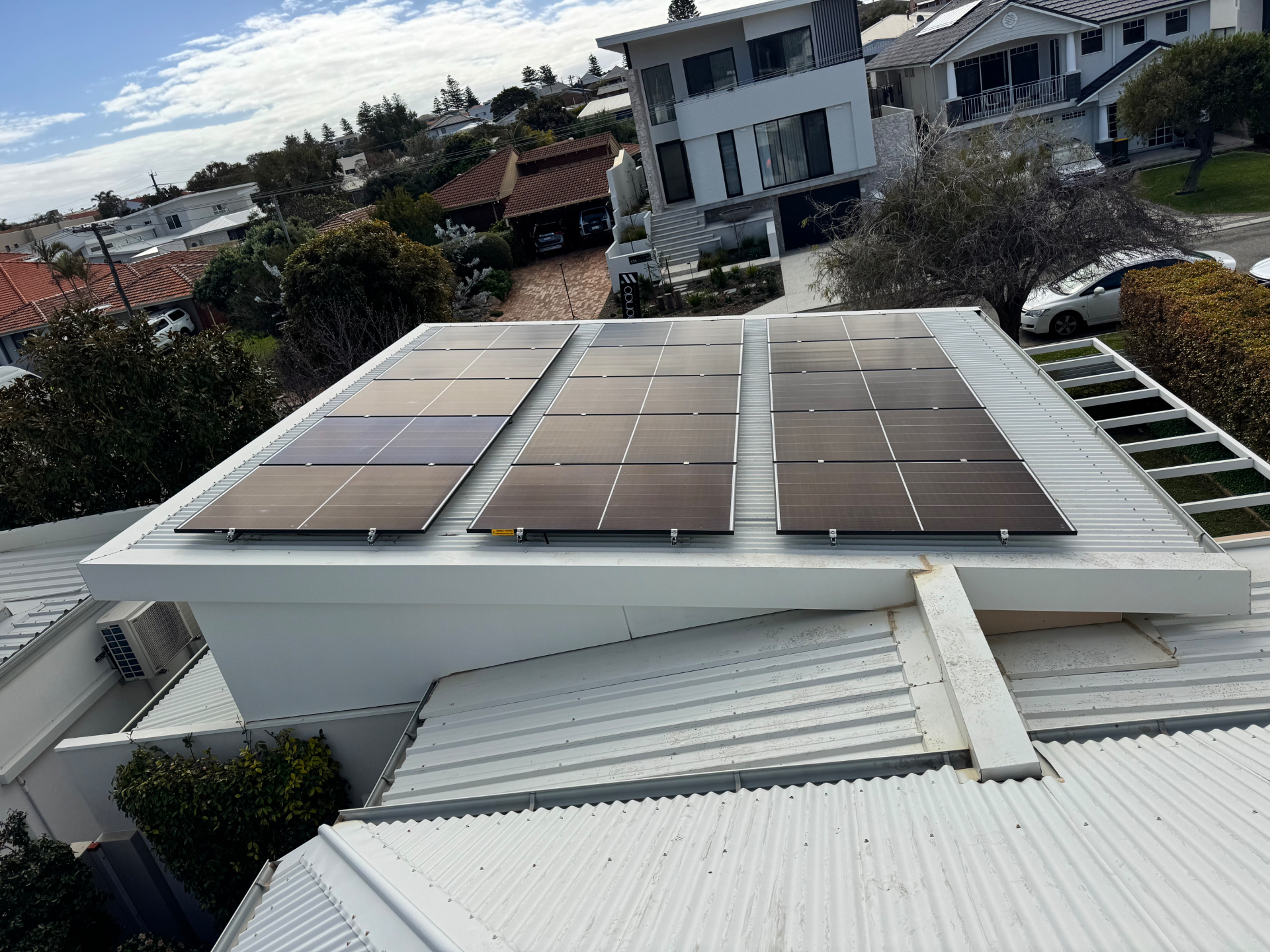 Drone view of 15kW of Jinko solar panels on a Perth Colorbond roof