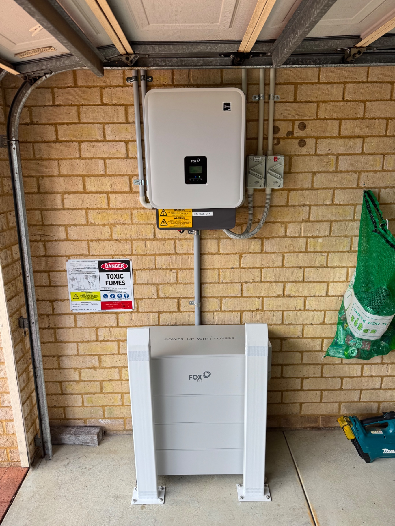 Fox ESS KH10 hybrid inverter and battery installed in a Pinjarra garage, front view