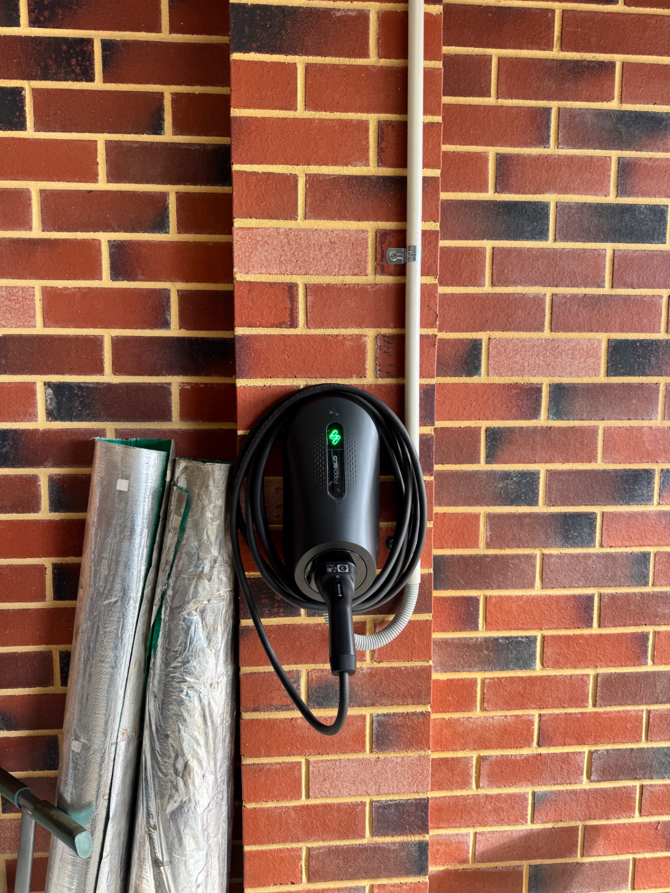 Zappi GLO on charcoal and red brick