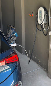 Solar-diverting charger — side-of-house