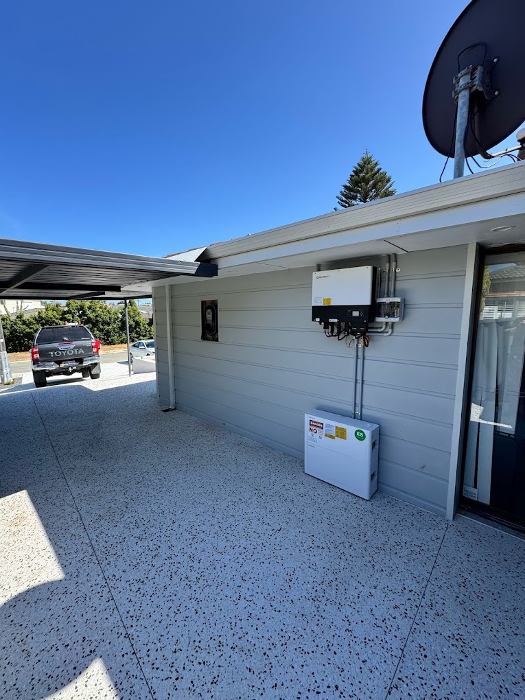 Inverter and battery, side of house