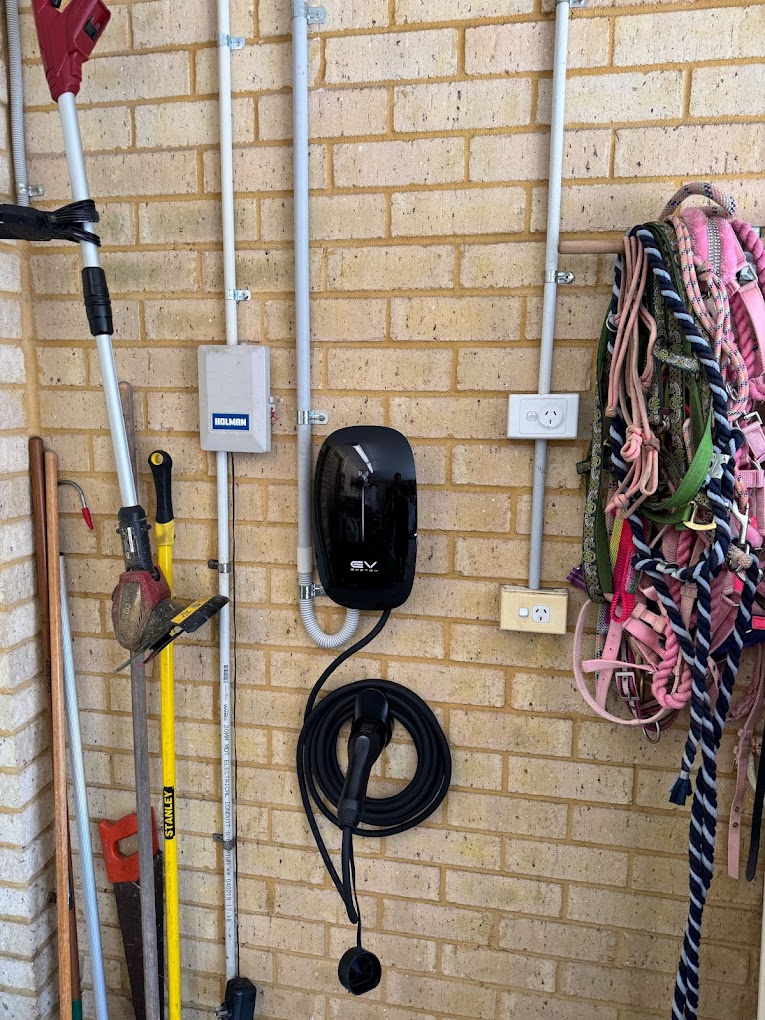 Black charger in a shed