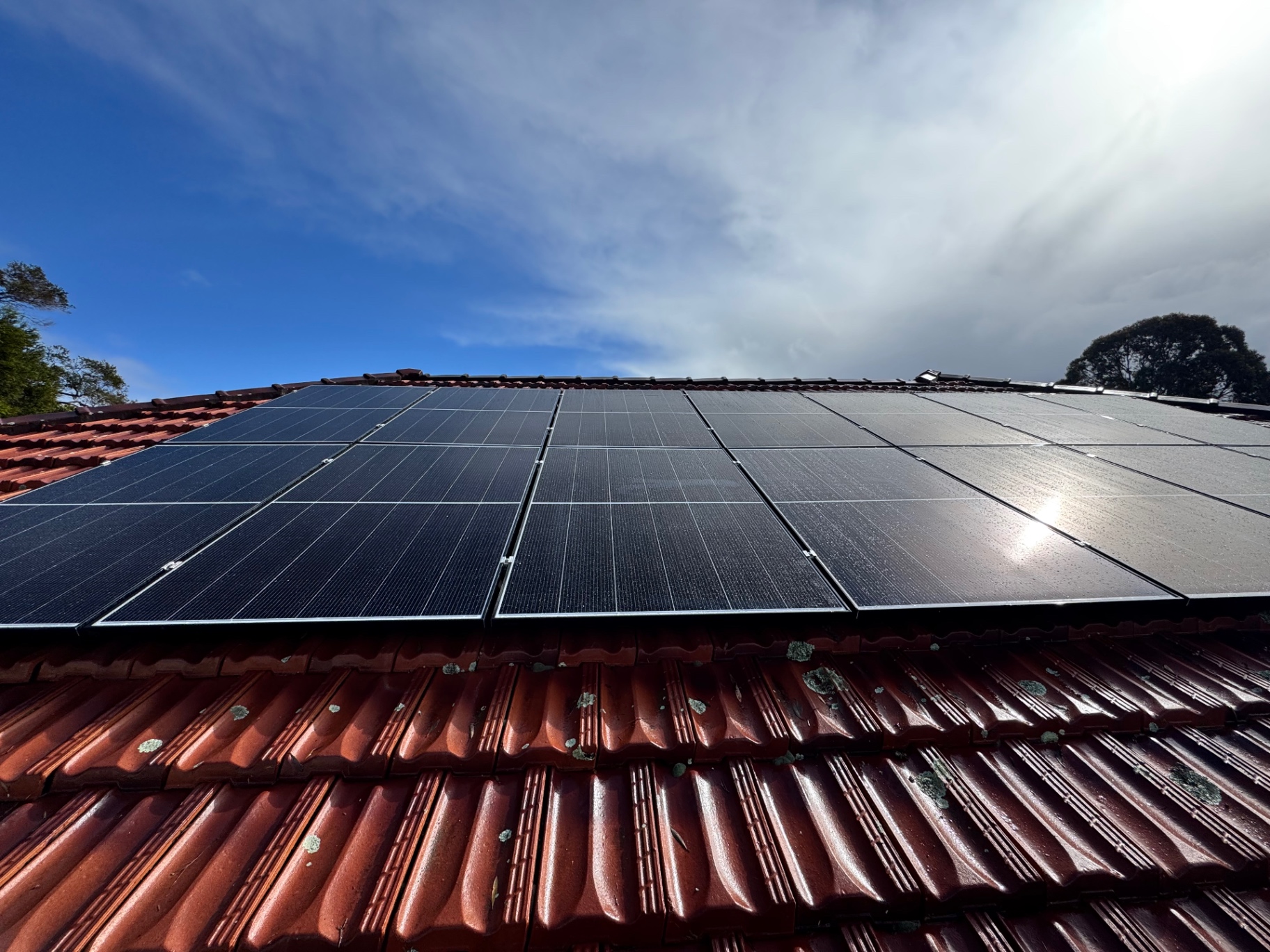 10kW Jinko solar array across a red tile roof in Beechboro