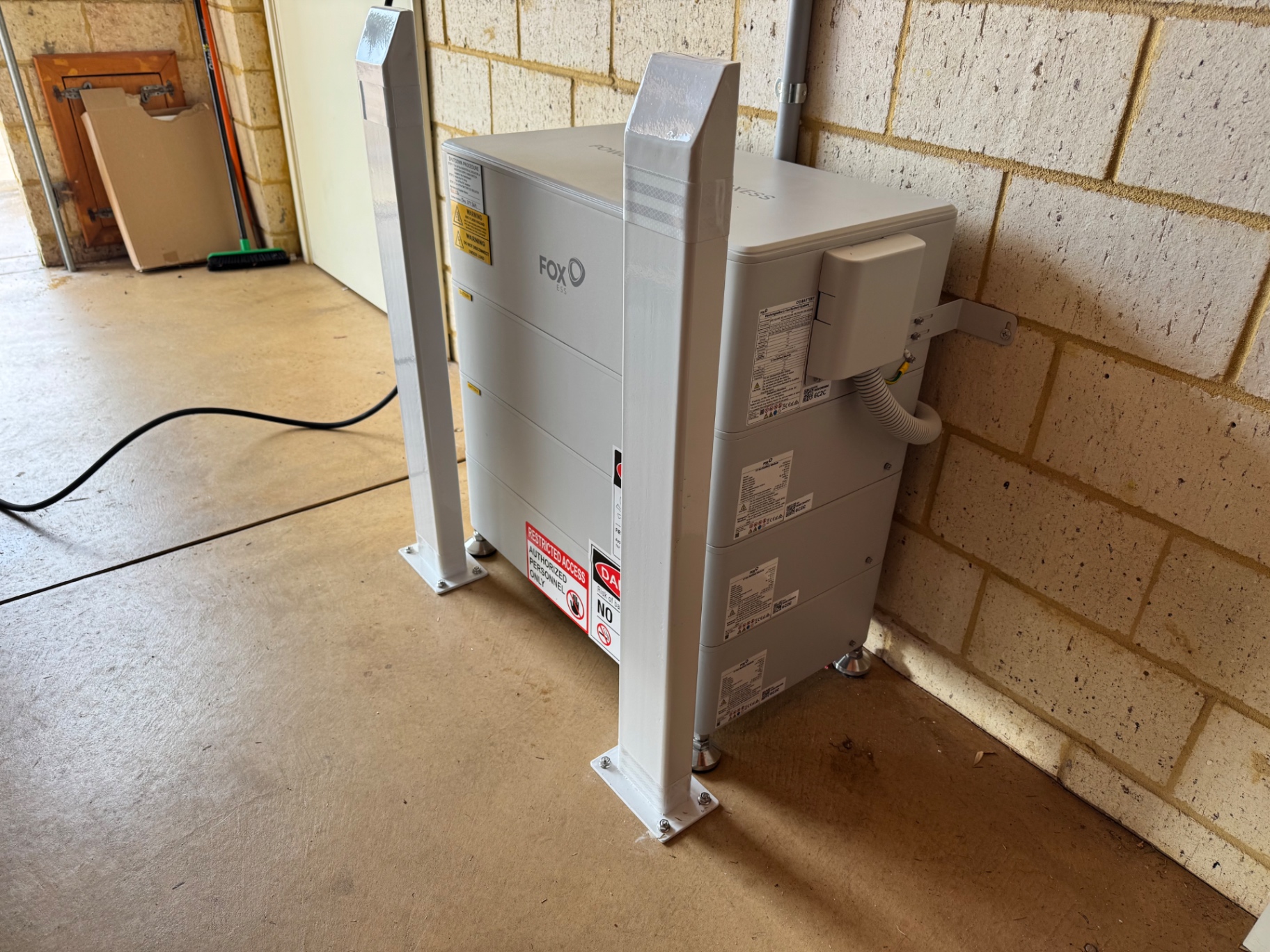 27kWh Fox ESS battery with protective bollards in a Beechboro garage