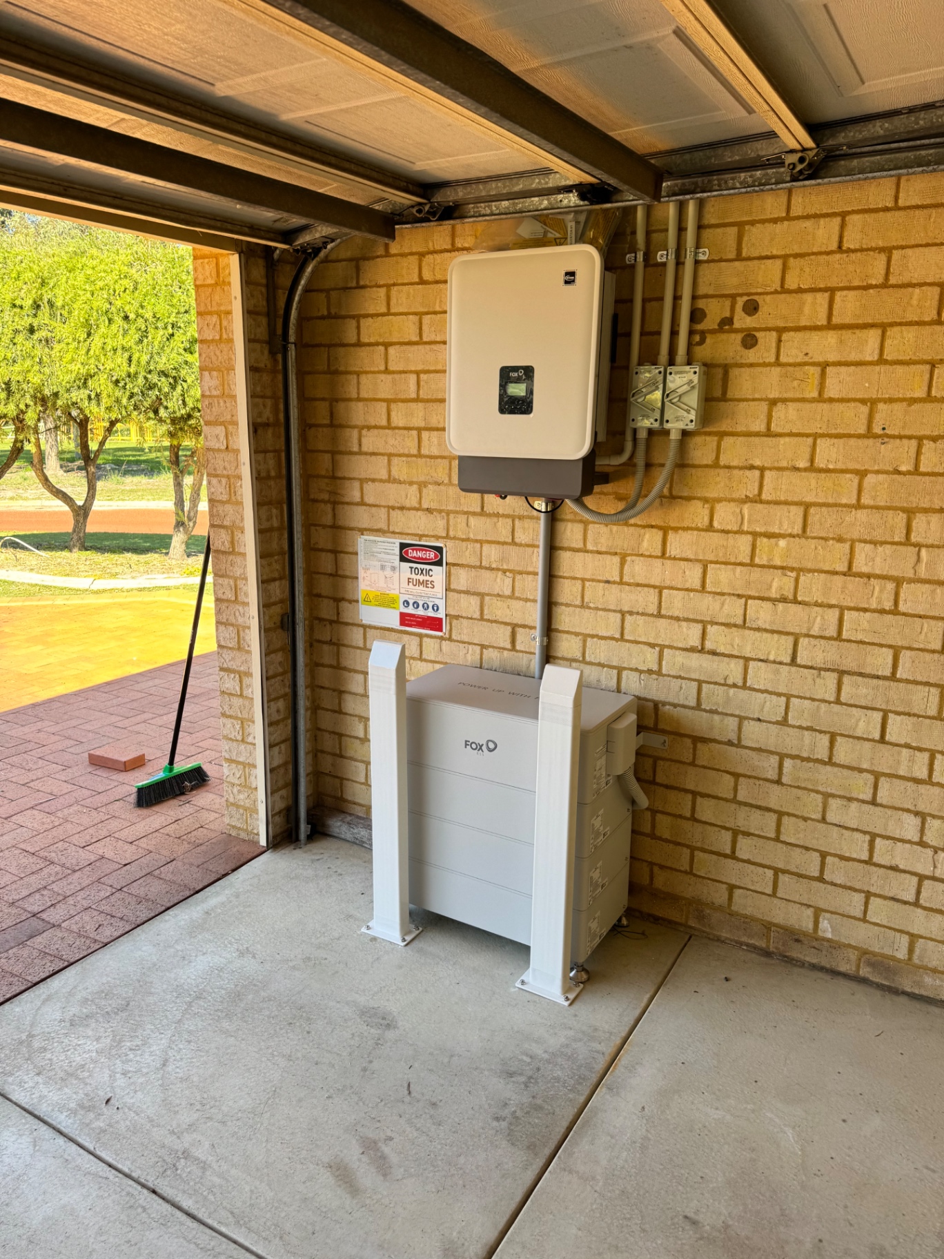 Wide view of the finished Fox ESS battery and inverter install in a Pinjarra garage