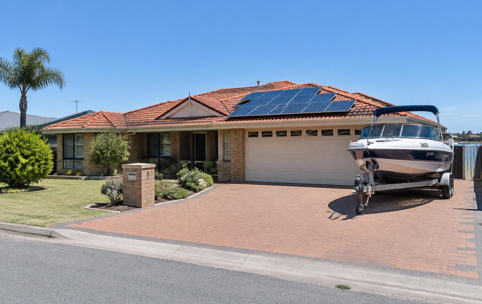 A Mandurah family home with rooftop solar and a garage ready for overnight charging.